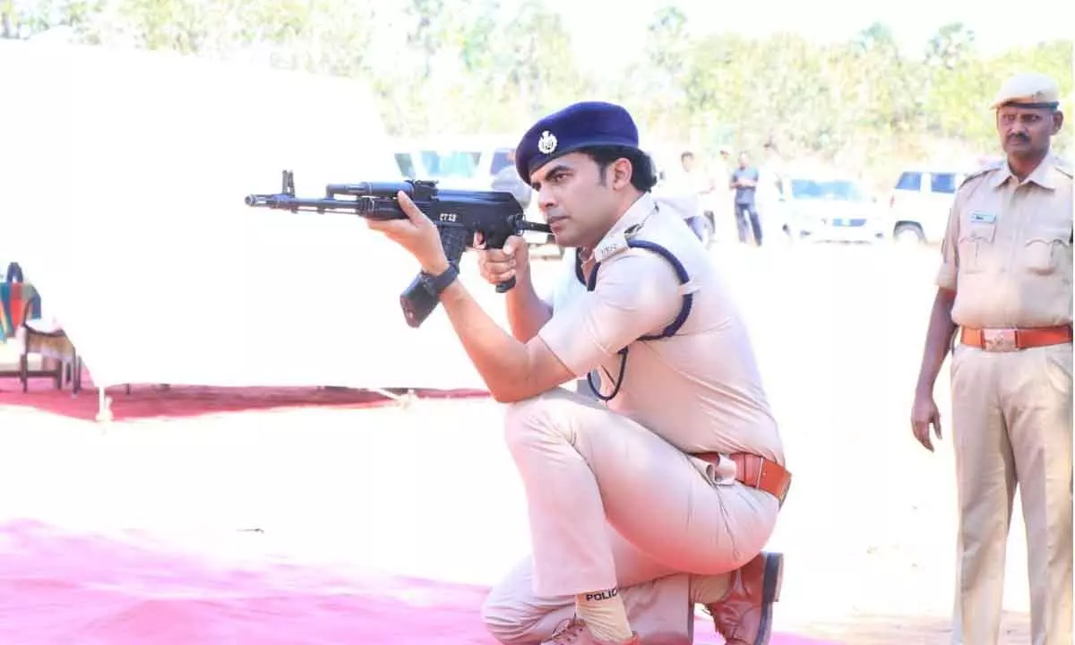 SP Y Rishanth Reddy demonstrating firing in sitting position at Firing Practice Range at Gangadhara Nellore mandal on Saturday