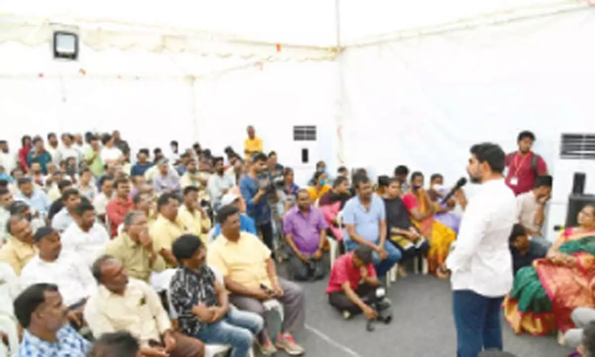 TDP national general secretary Nara Lokesh addressing construction workers in Tirupati on Saturday