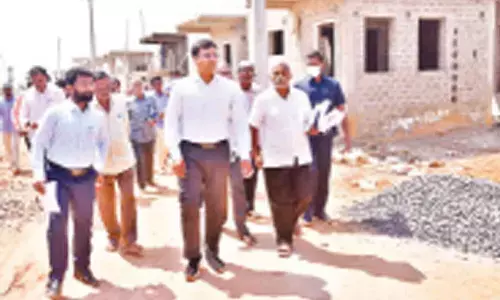 District Collector K V N Chakradhar Babu inspecting Jagananna Colony at Musunuru in Kavali on Saturday