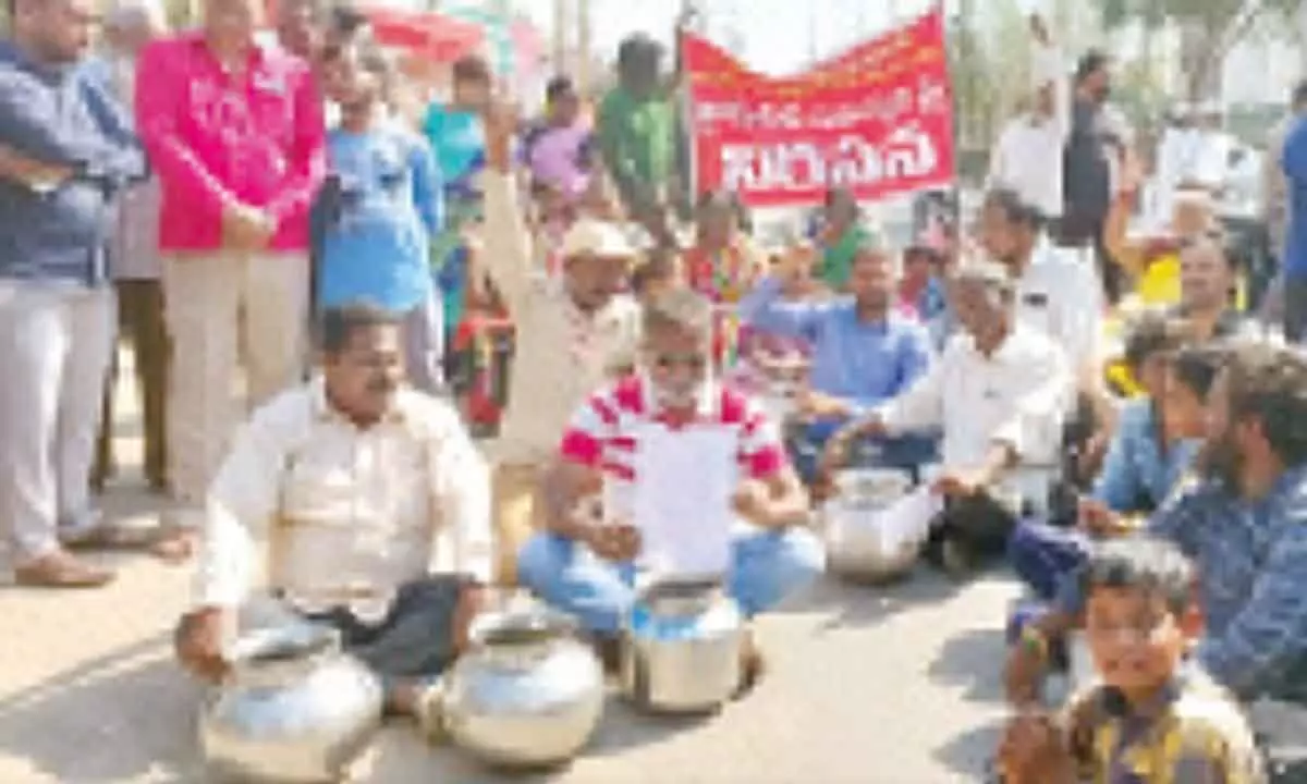 Residents of Priyadarshani Colony and others protest demanding supply of drinking water to their colonies near Karimnagar city on Sunday.