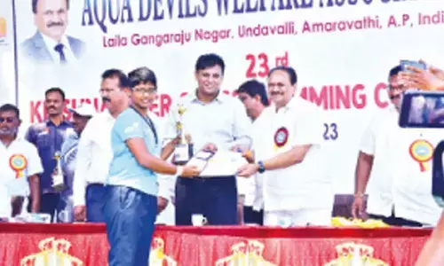 NTR district Police Commissioner Kanti Rana Tata presenting award to a winner in Vijayawada on Sunday