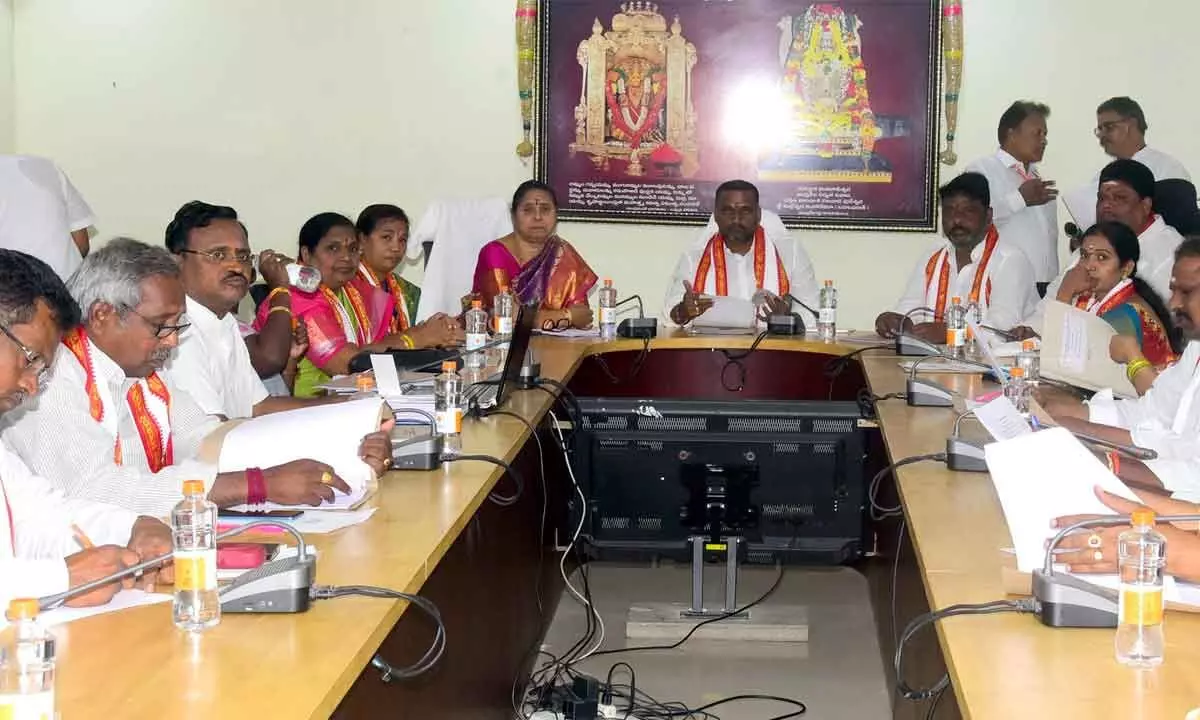 Sri Kanaka Durga Temple Trust Board Chairman Karnati Rambabu, Executive Officer D Bramaramba and members participating in a meeting in Vijayawada on Monday
