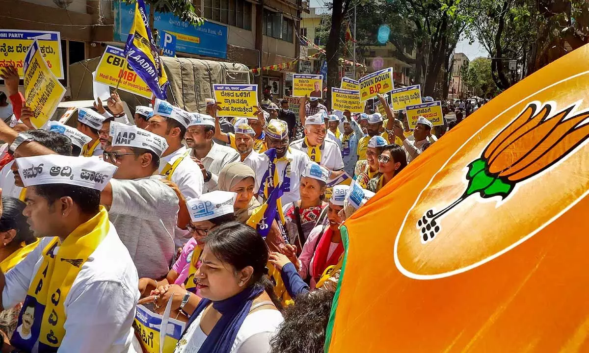 AAP supporters stage a protest over Delhi Deputy Chief Minister Manish Sisodias arrest by CBI in the excise policy case outside BJP office in Bengaluru on Monday