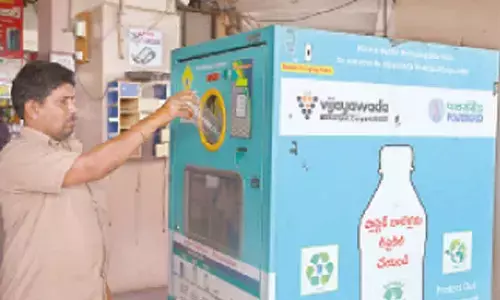 Public depositing a used plastic bottle in a recycling machine at APS RTC bus stand in Vijayawada on Monday  (Hans photo: Ch Venkata Mastan)