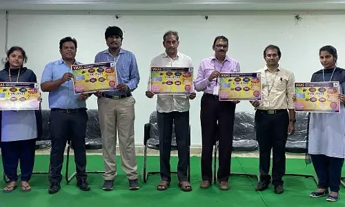 Vikas Group of Educational Institutions Secretary and Correspondent Naredla Satyanarayana Reddy releasing a poster at the college in Nunna on Tuesday