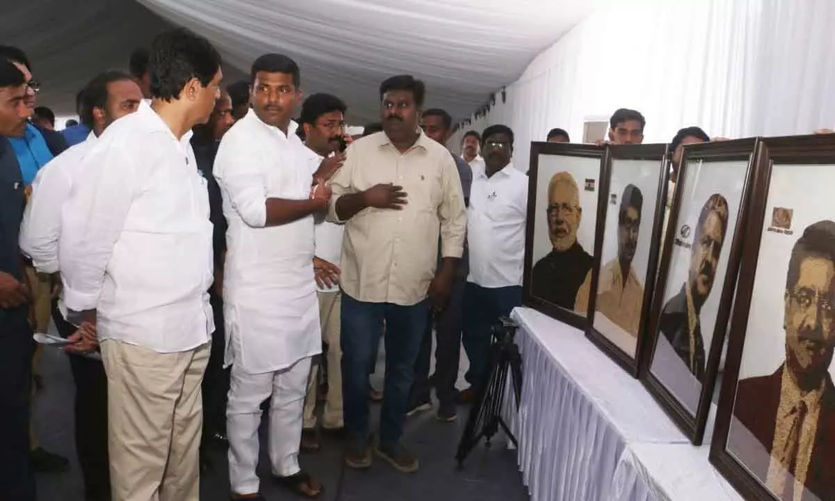 Ministers going through the millet portraits brought out artist Vijaya Kumar in Visakhapatnam