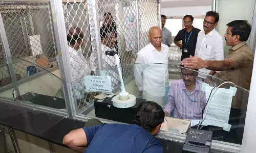 TTD EO A V Dharma Reddy inspecting the functioning of facial recognition technology which was introduced by TTD in select areas in Tirumala on March 1, at a counter in Tirumala on Thursday