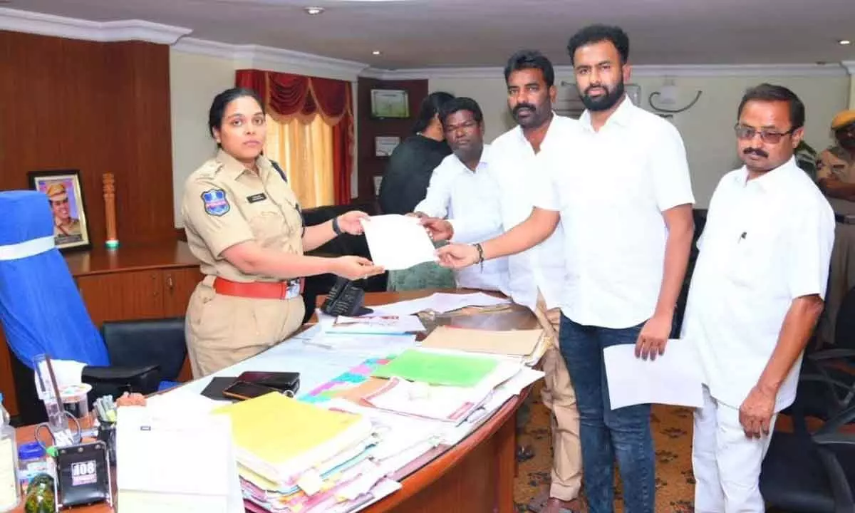 Dr Cheruku Suhas submitting a complaint to SP Apoorva Rao in Nalgonda on Tuesday