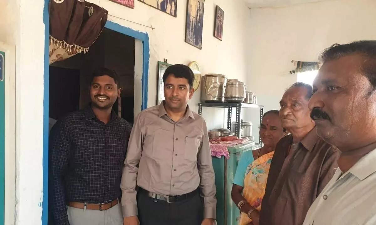 Managing director of AP Housing Development Corporation Lakshmi Sha interacting with a beneficiary