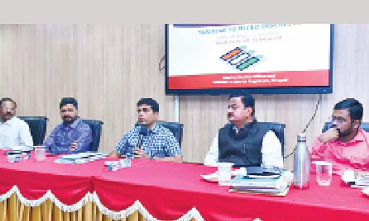 Election observers K Bhaskar and K Sasidhar, District Collector K Venkataramana Reddy and other officials at a training programme held for micro-observers in Tirupati on Tuesday