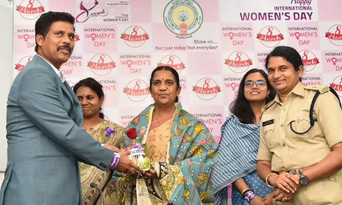 NTR district collector S Dilli Rao felicitating women employees in Vijayawada on Tuesday