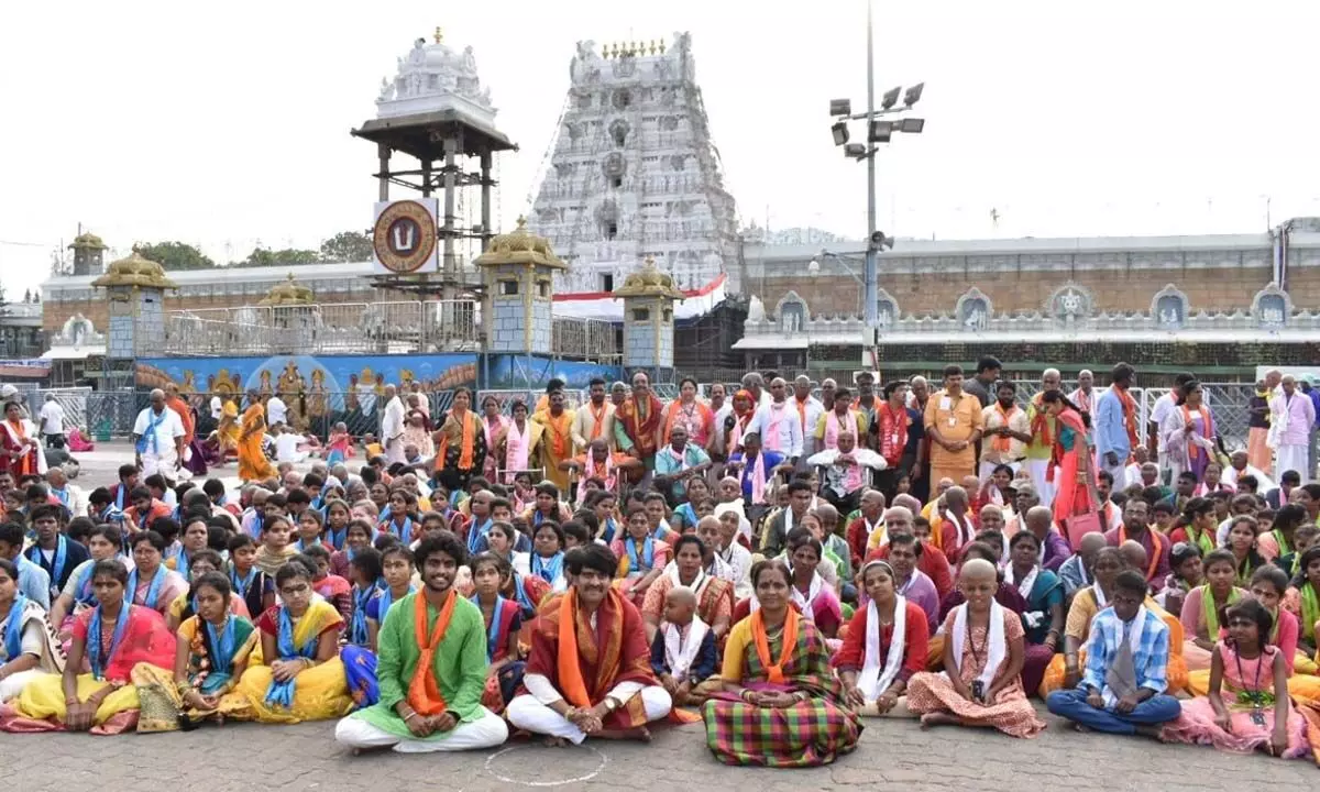 Specially-abled students in front of the temple at Tirumala on Tuesday after having darshan of Lord Venkateswara