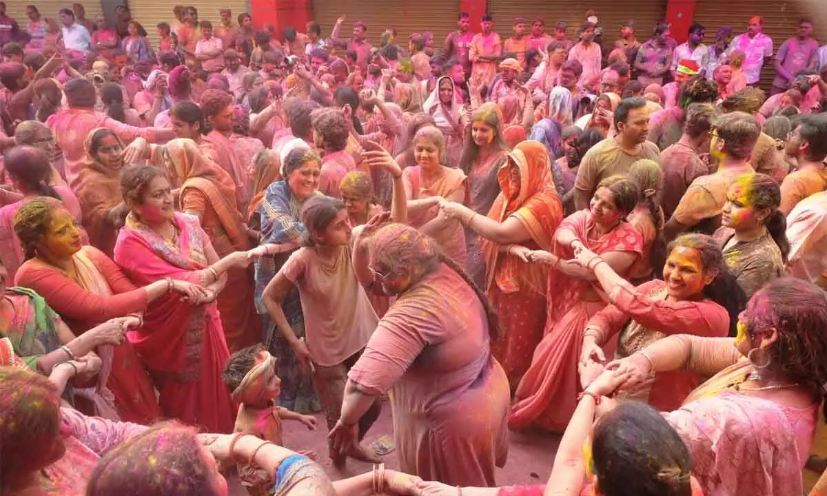Erupts in colours of joy, revelry
