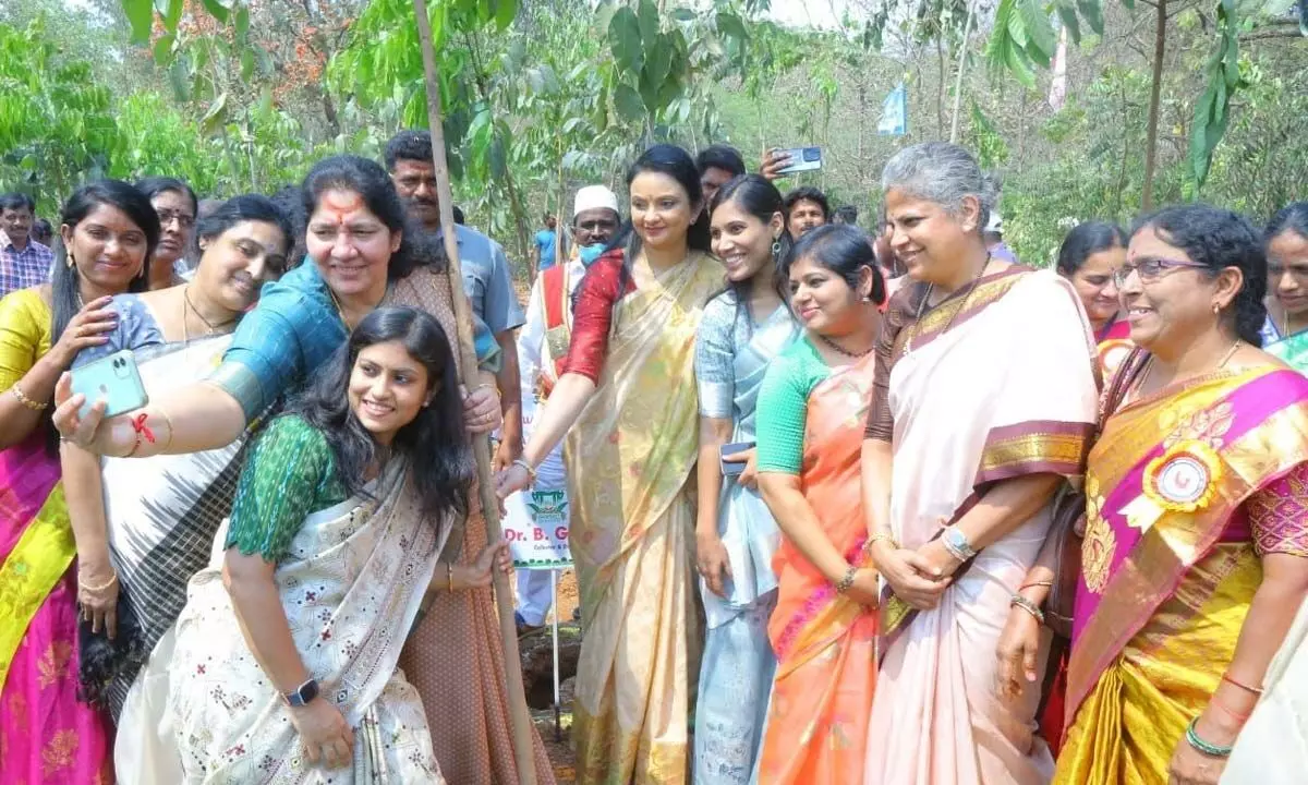 Minister for Tribal Welfare Satyavathi Rathod taking selfie with Hanumakonda district collector Sikta Patnaik and Special Secretary and Commissioner, Women and Child Welfare and Senior Citizen Bharati Hollikeri after planting a sapling at Kakatiya University campus on the occasion of International Women’s Day on Wednesday
