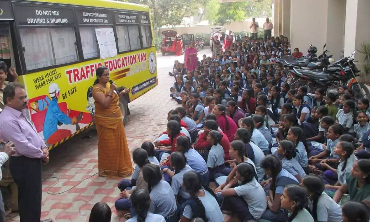 International Human Rights Protection Commission Secretary R K Shobha Rani creating awareness among school going girls on traffic awareness, in Chittoor on Wednesday