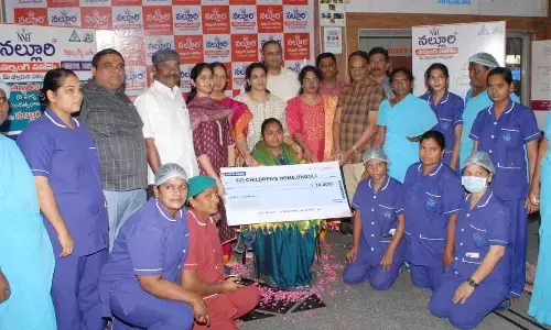 Management and staff of Nalluri Nursing Home felicitating Pratyusha of FFI Orphaned Children Home in Ongole on Wednesday