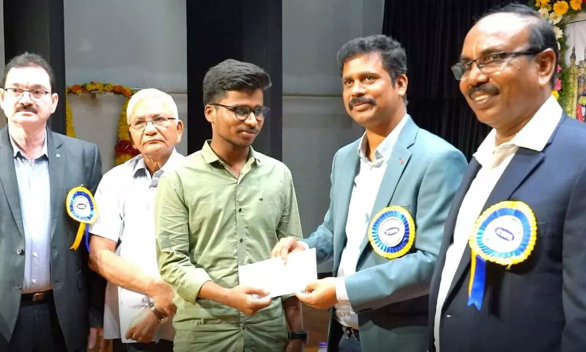 District Collector S Dilli Rao distributing scholarships to students at a programme in Vijayawada  on Sunday