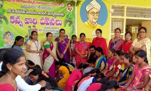 Parents blessing their children at APSWREI at Peddapadu on Sunday