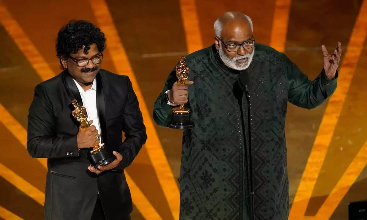 Music composer MM Keeravaani and lyricist Chandrabose accept the award for best original song for ‘Naatu Naatu’ from film ‘RRR’ at the Oscars 2023, in Los Angeles on Sunday