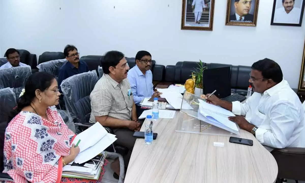 Social welfare minister Merugu Nagarjuna reviews progress of Jal Jeevan Mission works with officials at the Secretariat on Monday