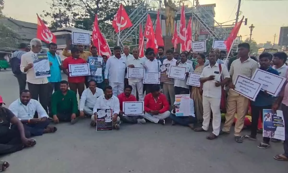 CPM and CPI activists staging a dharna at Ambedkar statue in Tirupati on Monday