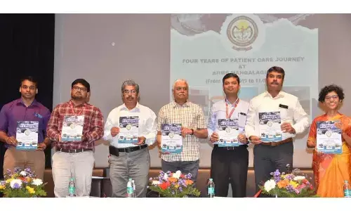 AIIMS Mangalagiri director and CEO Prof  Mukhesh Tripati (centre) along with other authorities of the hospital releasing brochures on AIIMS Mangalagiri’s journey in the last four years at a programme at hospital premises on Monday