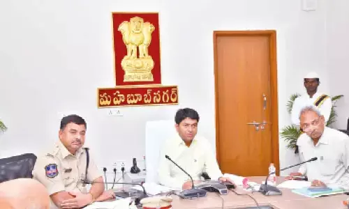 Collector G Ravi Nayak attending the video in Mahbubnagar on Monday