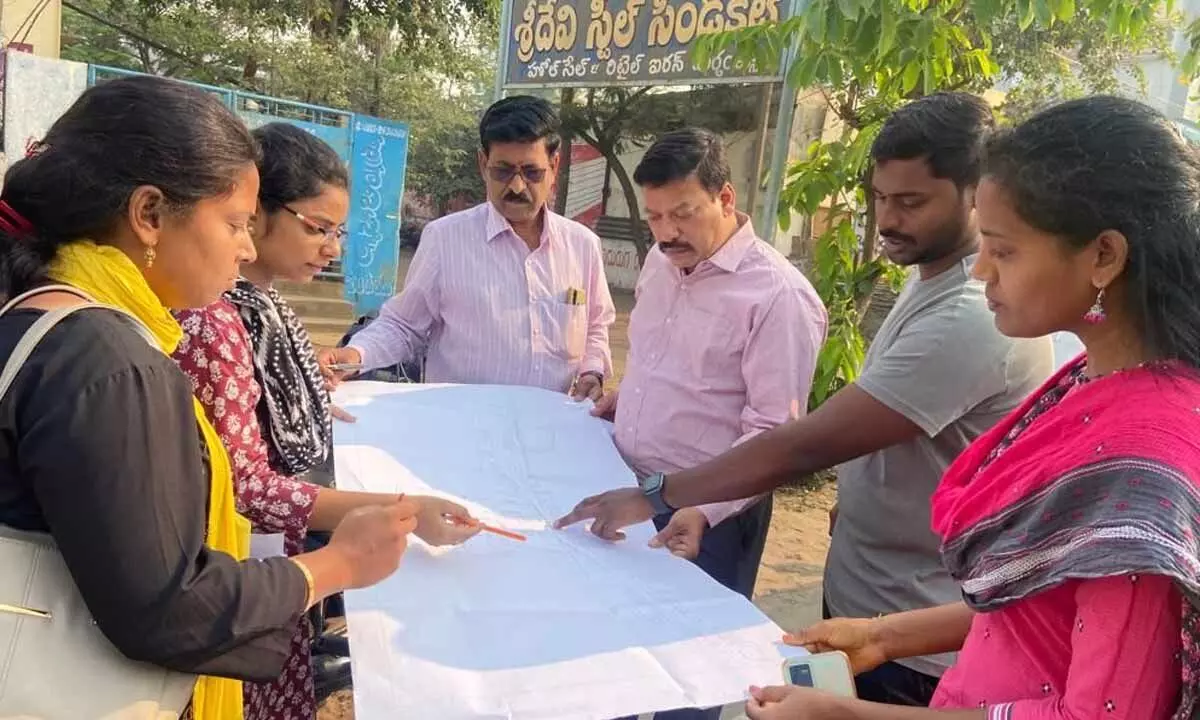 Rajahmundry Municipal Commissioner Dinesh Kumar discussing the master plan of road widening with the officials in Rajamahendravaram on Tuesday