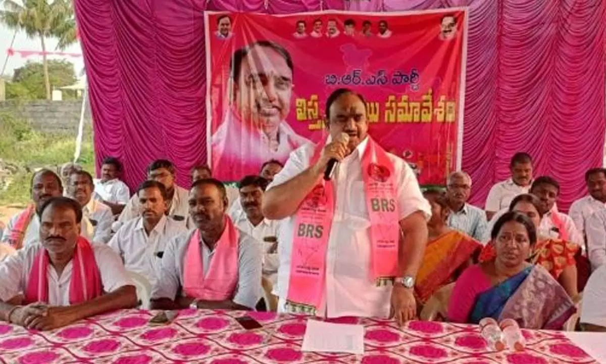MLA V Sathish Kumar speaking at BRS party workers meeting at Husnabad on Tuesday.