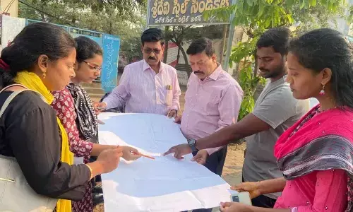 Rajahmundry Municipal Commissioner Dinesh Kumar discussing the master plan of road widening with the officials in Rajamahendravaram on Tuesday