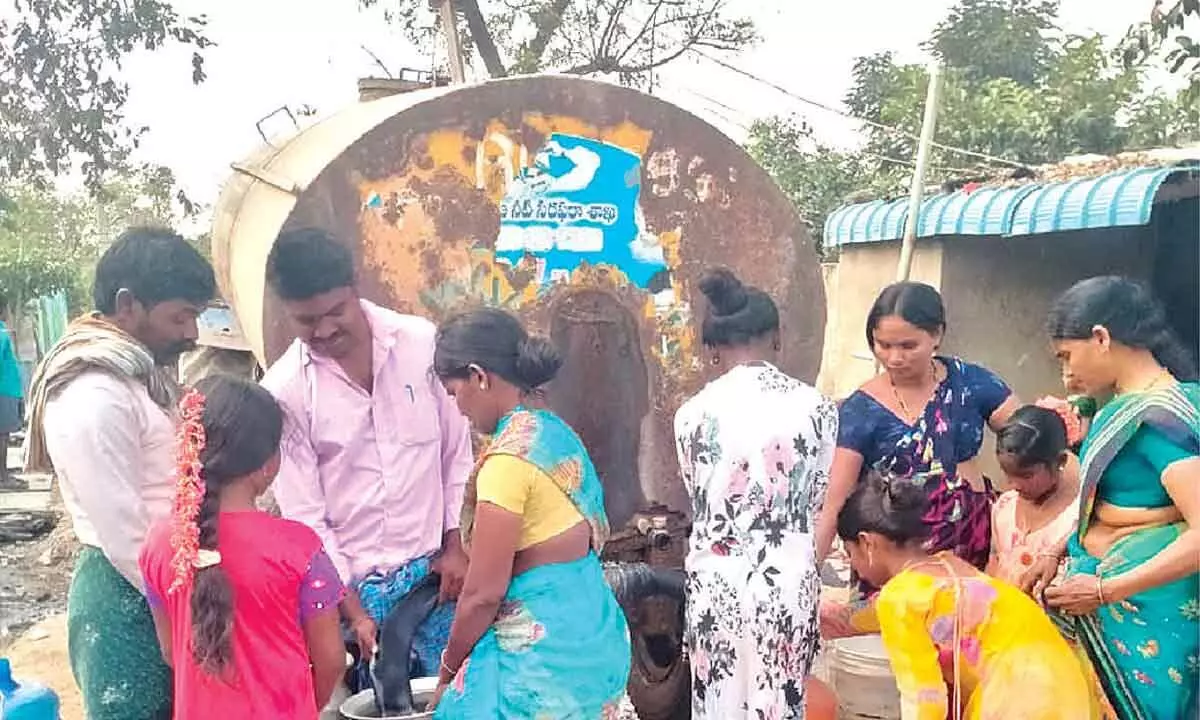 Villagers of Gangavaram of Pullalacheruvu mandal receiving water from a tanker on Wednesday