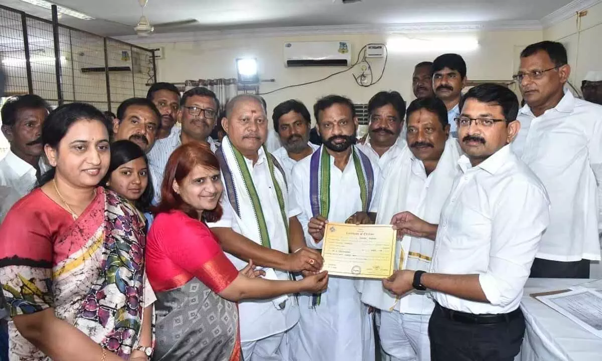 Returning Officer and Joint Collector Rama Sunder Reddy handing over declaration form to Dr A Madhusudhan at Silver Jubilee Degree College in Kurnool on Thursday