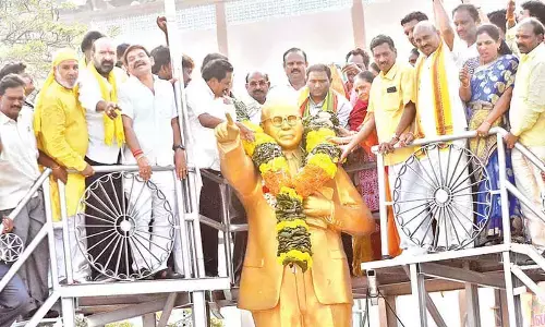 Newly-elected MLC Dr K Srikanth, G Narasimha Yadav, M Sugunamma and others garlanding the statue of Dr BR Ambedkar in Tirupati on Sunday.