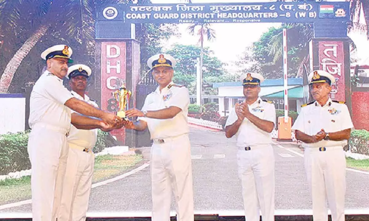 ADG S Paremesh, Coast Guard Commander, Eastern Seaboard, awarding the best support trophy to CGDHQ-8 Haldia