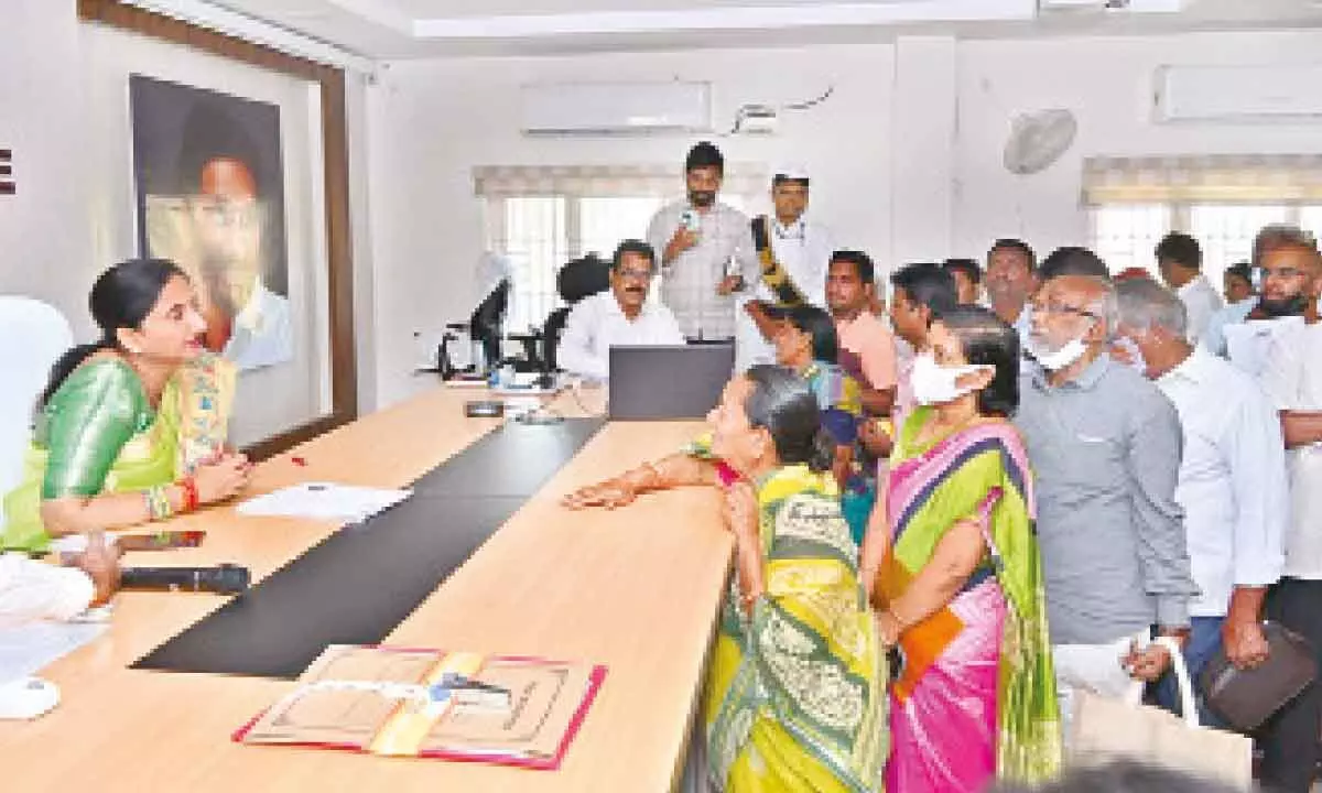 District Collector Dr K Madhavi Latha interacting with the petitioners during Spandana programme at the Collectorate in Rajamahendravaram on Monday
