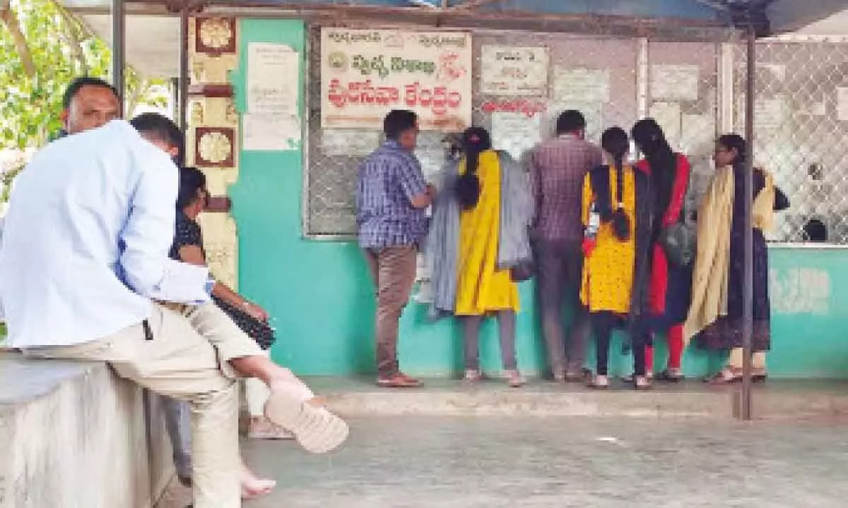 People waiting at a ‘pura seva kendram’ to pay taxes across the counter in Vepagunta in Visakhapatnam. Photo: Vasu Potnuru