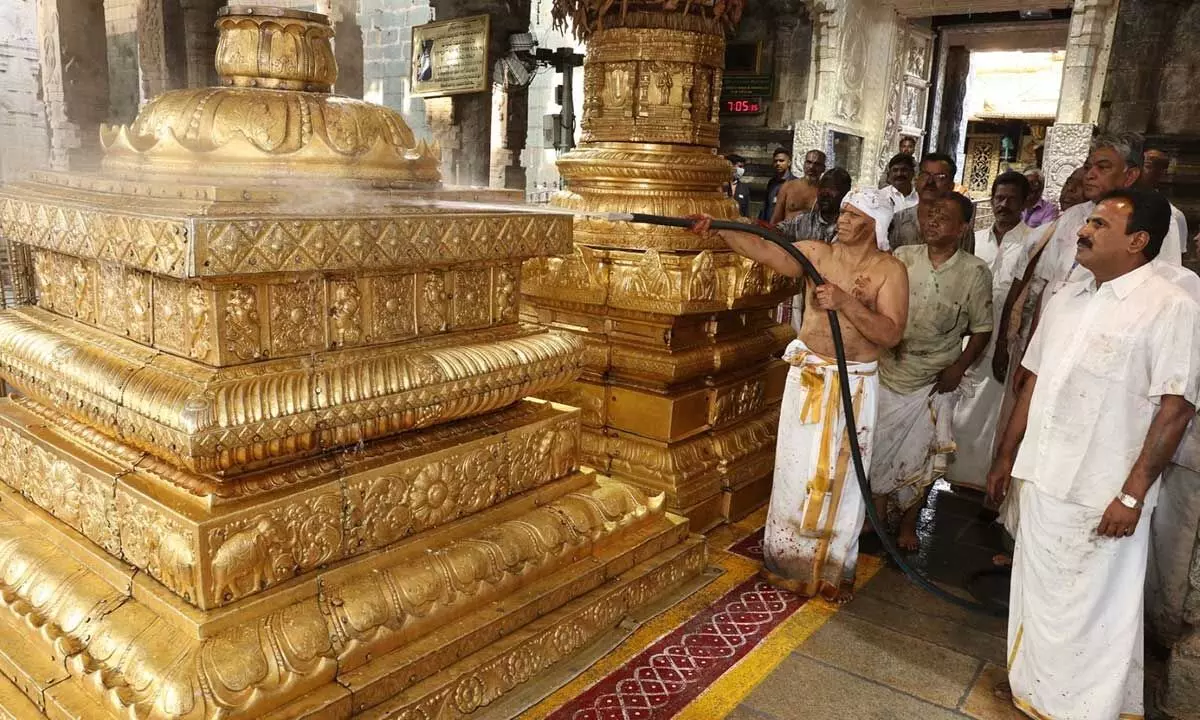 On the occasion o Koil Alwar Tirumanjanam in Tirumala temple, TTD EO cleaning Dwajasthambham and Balipeetam in the shrine on Tuesday.