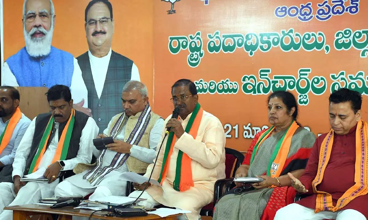 BJP state president Somu Veerraju addressing the BJP state office bearers meeting at party state office in Vijayawada on Tuesday. AP in-charge Sunil Deodhar, former Union minister Daggubati Purandeswari and party leaders are also seen Photo: Ch Venka Mastan