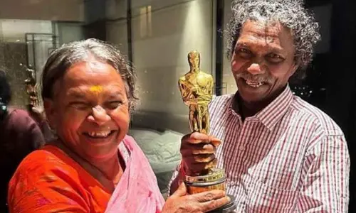 The Elephant Whisperers pose with Oscar Award