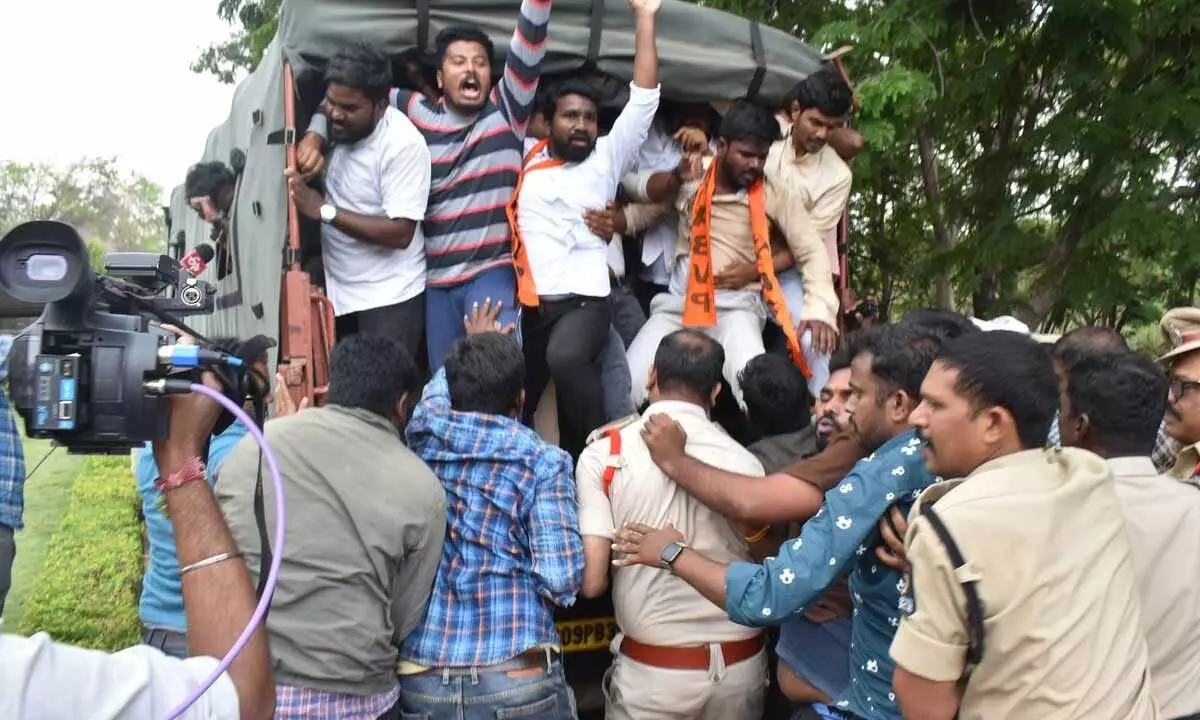 Police detaining ABVP activists as they continue their protest against TSPSC paper leak at OU  Campus in Hyderabad on Saturday