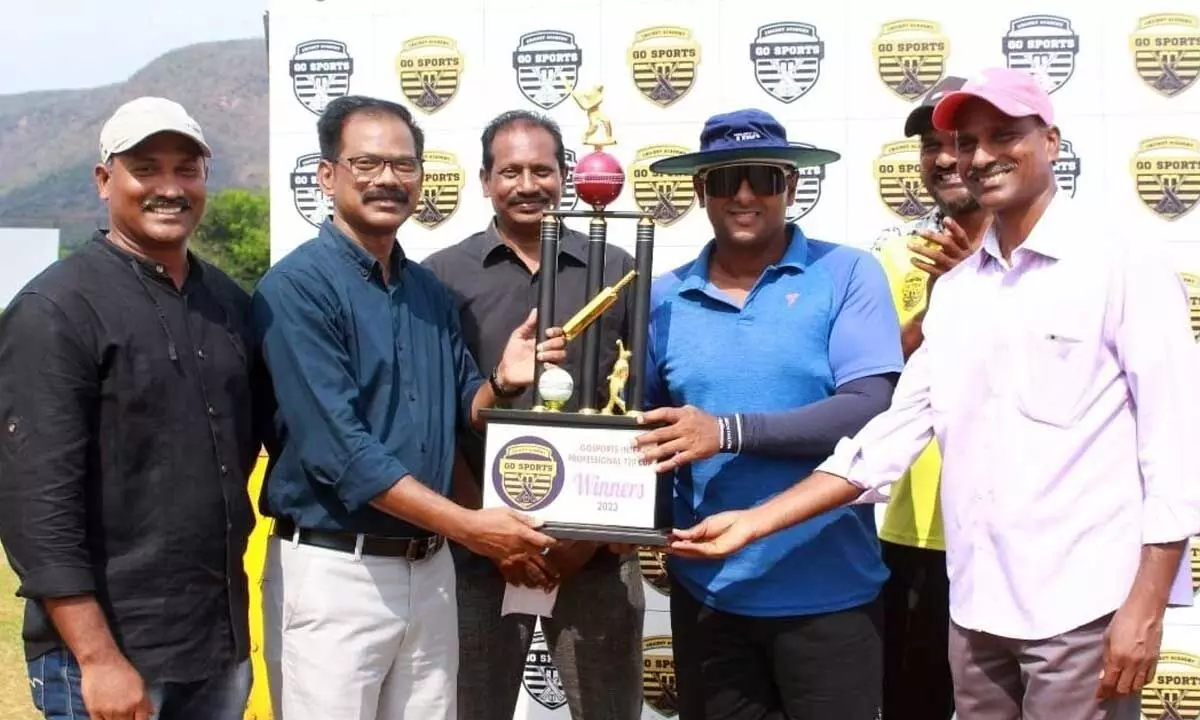 GoSports Cricket Academy directors presenting the championship cup to Commissioner of Police Kanti Rana Tata at Adavinekkalam on Sunday