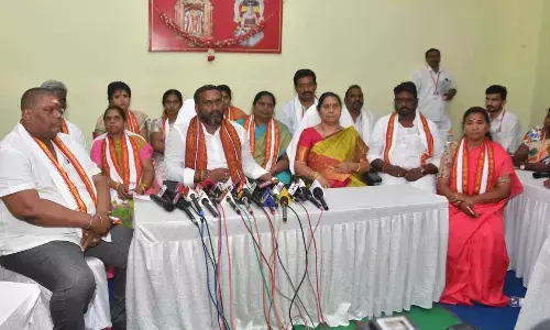 Sri Durga Malleswara Swamy Temple Trust Board chairman  Karnati Rambabu disclosing the Board meeting details to the press in Vijayawada on Monday. Temple EO Bhramaramba is also seen.