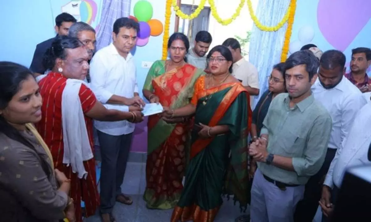 Minister KTR handed over a cash cheque to transgenders in Sircilla on Monday.