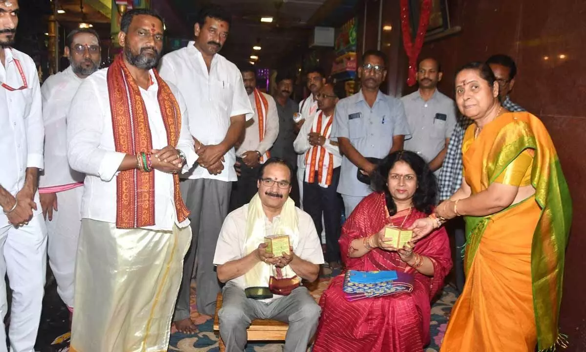 Sri Kanaka Durga temple EO D Bramaramba offering prasadam to High Court Chief Justice Prashant Kumar Mishra and his spouse at the temple in Vijayawada on Tuesday