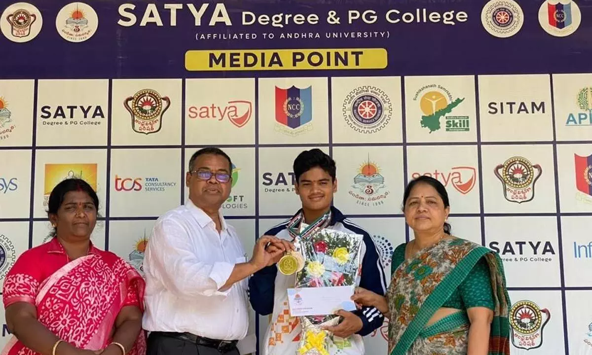 K Pallavi being congratulated by Satya College management in Vizianagaram on Wednesday
