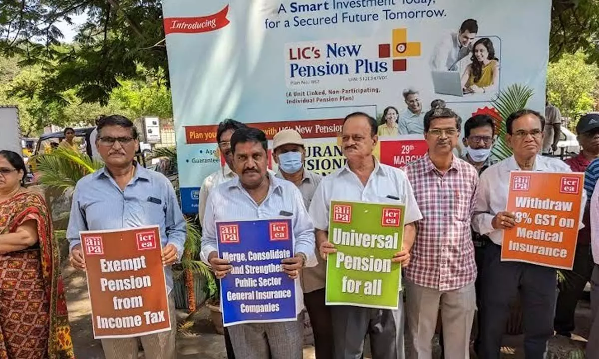 Holding placards, LIC pensioners and employees staging a protest in Visakhapatnam on Wednesday