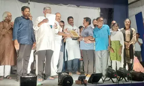 Telugu Kala Samithi members receiving an award from the guests at the prize distribution programme in Ravulapalem