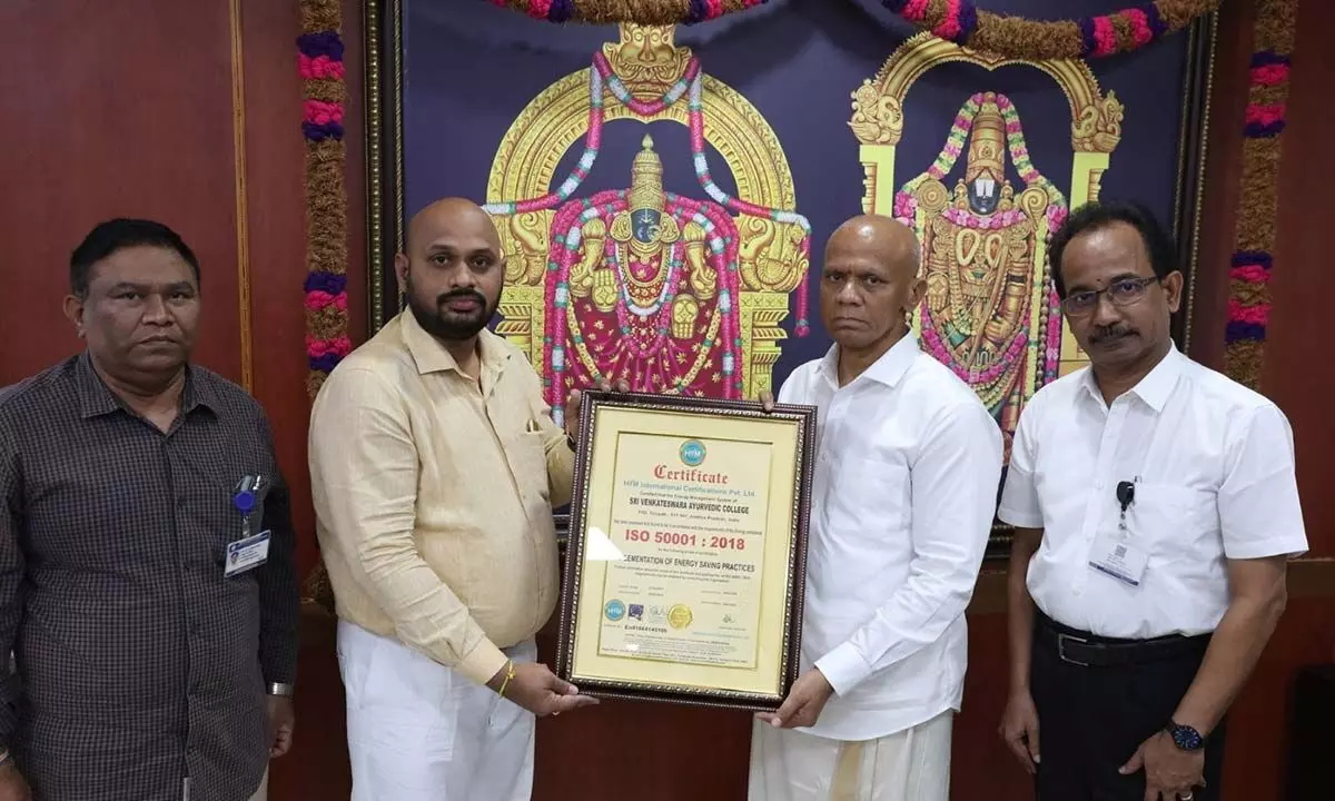 TTD EO A V Dharma Reddy presenting the ISO certificate to SV Ayurveda College Principal Dr Muralikrishna at TTD Administrative Building in Tirupati on Wednesday.