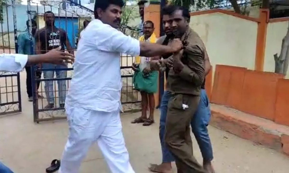 Rehaman seen creating panic situation in front of Pathikonda police station on Wednesday
