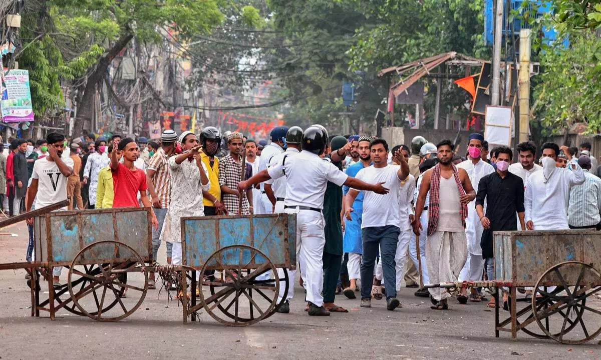 Security personnel cordon off an area after clashes broke out between two groups during a ‘Ram Navami’ procession on Thursday, at Kajipara in Howrah district on Friday